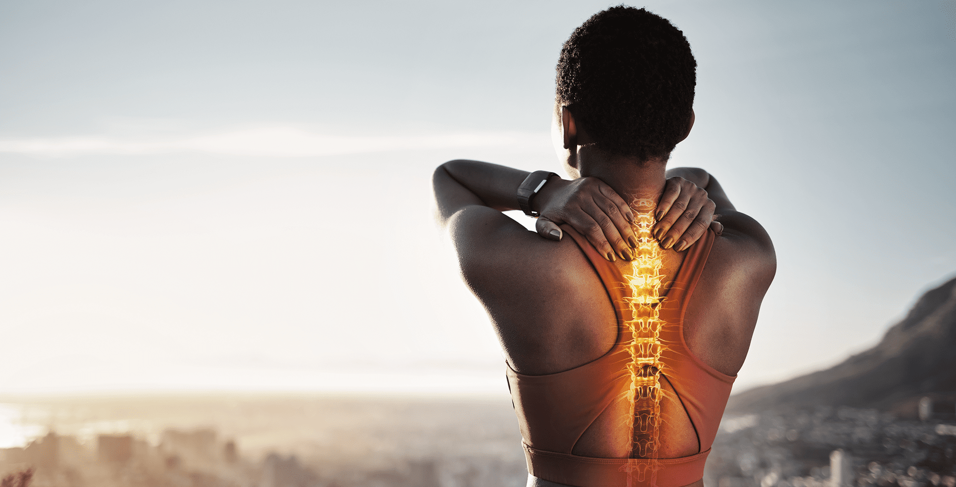 Woman stretching with highlighted spine illustration.
