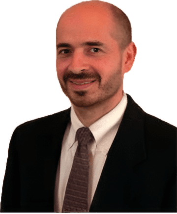 Man in a suit with a friendly smile.
